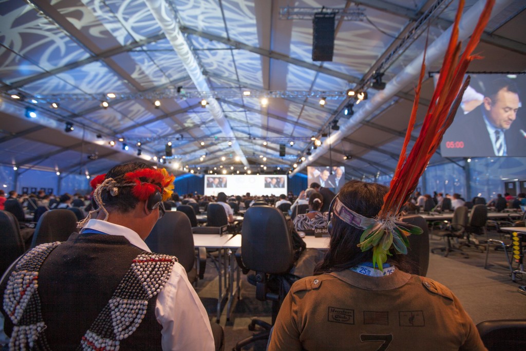 Indigenous participants sit in a plenary hall of COP20. The UN climate talks began on Dec 1st in Lima Peru, billed as the most important meeting in the history of the world, mechanisms for reducing climate change are being negotiated. The Fast for the Climate movement, with participation of environmental and faith-based groups such as the Lutheran World Federation, is reminding diplomats of the real dangers of climate change and urging them to take immediate action.
