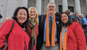 Trevor Sandison (center), longtime ELCA government relations volunteer for FAN, has put in long hours in Olympia this month! 