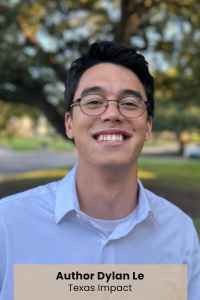 Person in front of a leafy tree and grassy courtyard