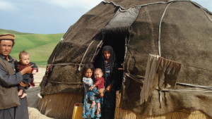 Following the series of rains, floods, and landslides, the affected population scattered across the north of Afghanistan face challenges in accessing shelter, water, food, and health services. Children pose for the camera in front of their home.