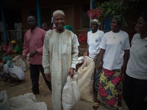 Happy beneficiary from Muslim community share a laugh with the women