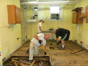 kitchen floor removal - POP volunteers