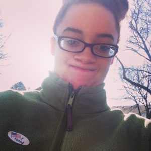 All Peoples Church member Sabryna, takes a selfie after voting for the first time.