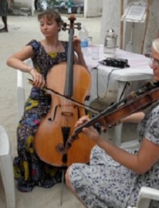 Megan Stubbs playing cello at a wedding in Zanzabar.