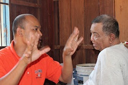 Sarin, (left) and his father, who was recently baptized.