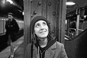 Pictured here: Mikayla Irle, a filmmaker interviewed for this blog post, looks up and to her left in a pose.