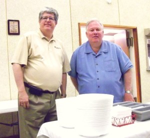 Pastor Michael Stadie (left) Program Director of Lutheran Disaster Response, Pastor Roger Bruns of Trinity Lutheran Church at the table that serves meals to volunteers who come to Oklahoma City to help with clean up.