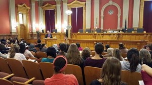 Bishop Jim Gonia addresses an audience gathered to learn about the refugee and asylum process at the Old Supreme Court Chambers in the Colorado Capitol on March 14. 