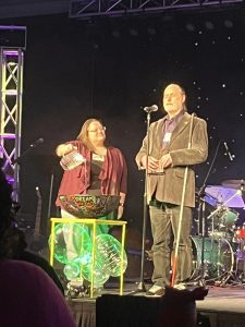 Anita and Peter standing at a baptismal bowl for the Thanksgiving for Baptism 